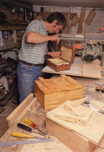 Peter Lloyd working on a box
